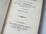 an open book with a title on it sitting on a table