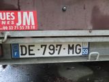 a license plate on the back of a truck