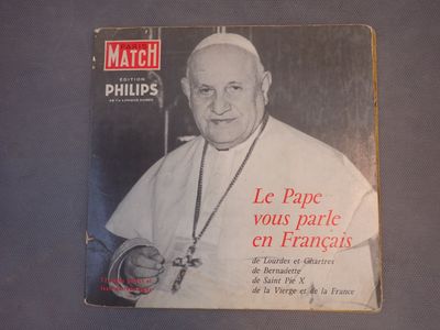 a book with a picture of a pope holding a rosary