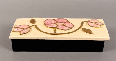 handmade ceramic box with pink flowers on black base