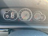 a close up of a car dashboard with various gauges