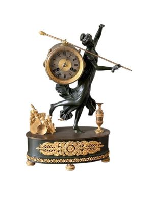 statue of a woman holding a clock and a sword on a table
