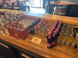many bottles of beer on a table in a restaurant