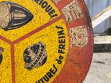 a yellow and red sign with a picture of different items on it