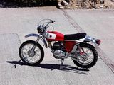 a red and white motorcycle parked on the side of the road