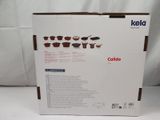 the box is open to show the contents of a coffee maker