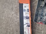 a snowboard that is laying on the ground next to a box