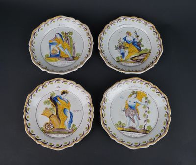 four plates with a picture of a man and a woman on them
