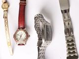 several different types of watches on a white surface