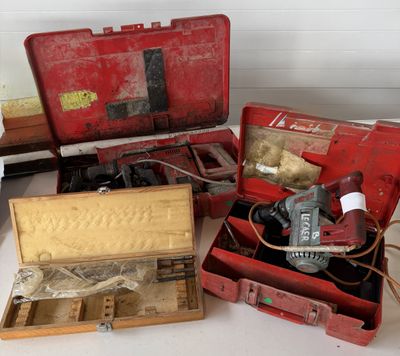a lot of tools in a red case on a table