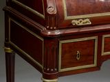 a small desk with a drawer on top of it