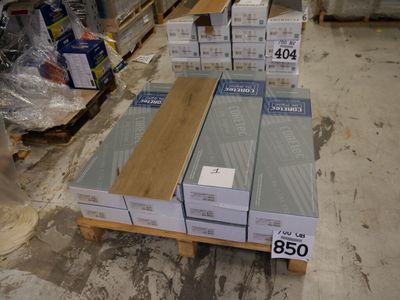 boxes of wood are stacked on a pallet in a warehouse