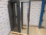 a metal rack that is sitting in the middle of a room