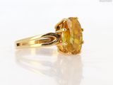 an image of a ring with a yellow topazr stone