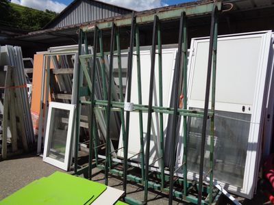 many different types of windows and doors in the yard