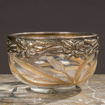 an image of a glass bowl sitting on top of a marble table