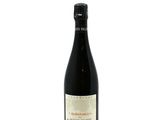 a bottle of red wine on a white background