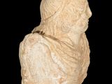 marble bust of a woman with a veil on a black background