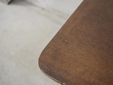 a close up of a wooden table with a book on it