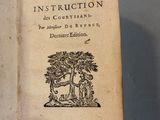 an open book with a picture of a man and a dog on it