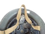 a close up of a helmet with a strap on it