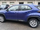 a blue toyota rav parked in a parking lot