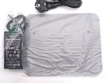 a plastic bag with a remote control and a charger on it