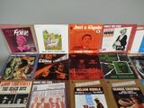 a lot of music books on a table together