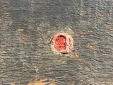 a piece of wood that has a hole in it