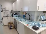 a kitchen with a lot of bags on the counter