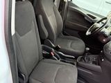 the interior of a white van with black seats and a steering wheel