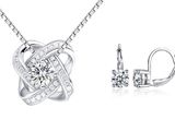 un ensemble composé d'un collier et de boucles d'oreilles en or blanc sertis de diamants