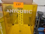 a yellow machine that is sitting on top of a table