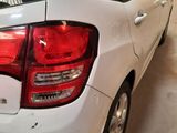 a white car that is parked in a garage