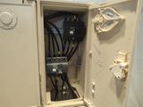 a white electrical box with wires and wires in it