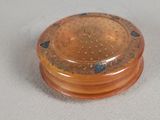 a close up of a small plastic object on a table