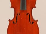 an old violin with a bow hanging from it ' s back