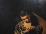 painting of a young boy sitting on a couch holding a cell phone