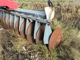 a tractor that is sitting in the middle of a field