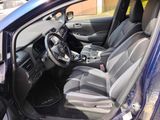 the interior of a car with the door open and the driver ' s seat down