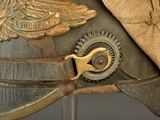 a close up of a military helmet with a gold eagle on it