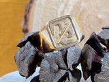 two rings that are sitting on top of a piece of wood
