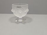 a clear glass bowl with a flower design on it