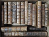 a box full of old books sitting on a table