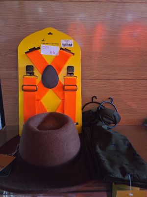 a hat on a desk with a laptop and other items
