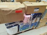 several boxes of toilet paper are stacked on a pallet in a warehouse