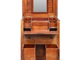 a wooden vanity with drawers and a mirror on top