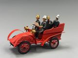 two men sitting in the back of a toy fire truck