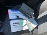a laptop computer sitting on top of a table in a car