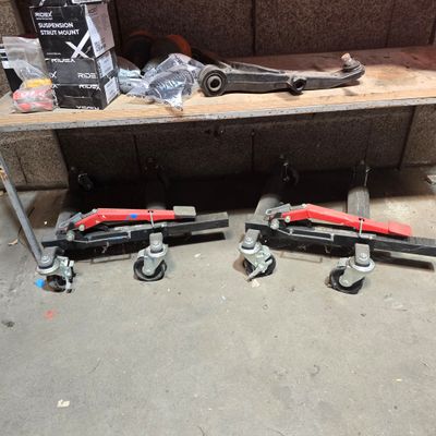 two tools that are sitting on the floor next to each other